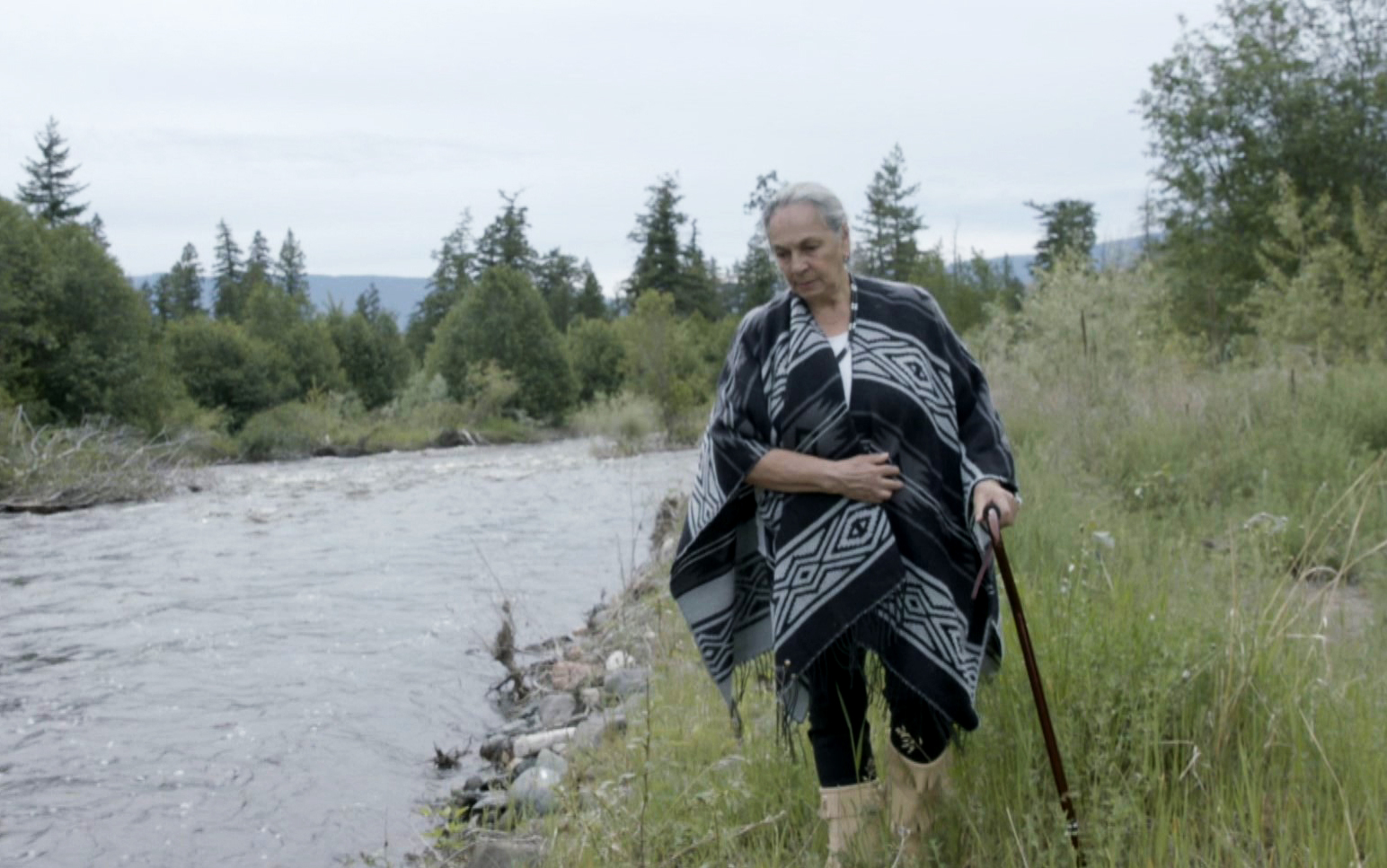 Barbara McNab-Larson walks along a creek near Skeetchestn First Nation in B.C. where she went as a child before being sent to Kamloops residential school. (CBC News)
